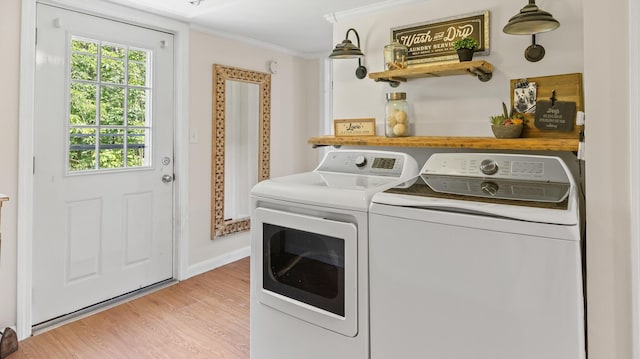 2857 Ohio St, Glenburn, ME 04401 - laundry area featuring independent washer and dryer, crown molding, and light wood-type flooring