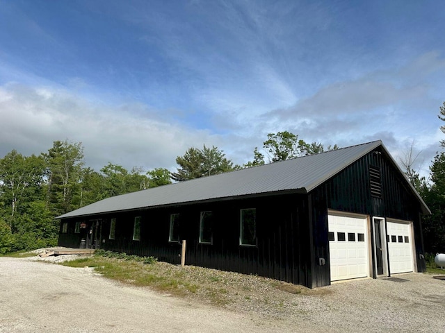 599 Mile Square Rd, Avon, ME 04966 - view of front of property featuring a garage and a metal roof