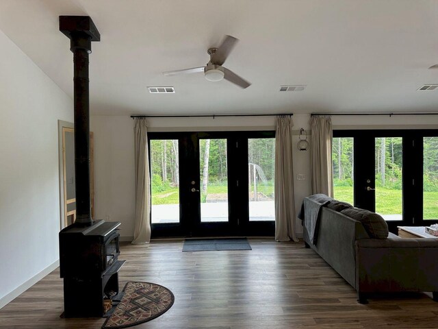 599 Mile Square Rd, Avon, ME 04966 - doorway to outside featuring a wood stove, wood finished floors, and french doors