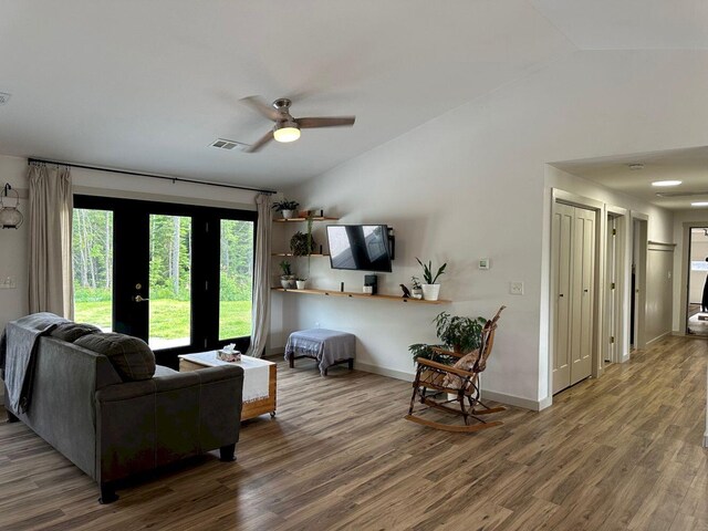 599 Mile Square Rd, Avon, ME 04966 - living room featuring vaulted ceiling, wood finished floors, and a ceiling fan