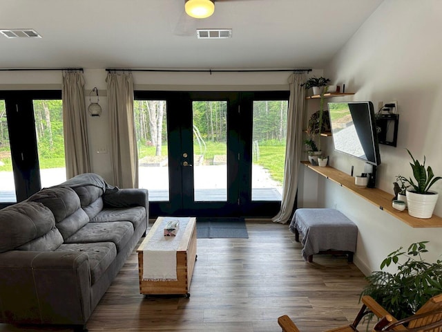 599 Mile Square Rd, Avon, ME 04966 - living room with wood finished floors and french doors