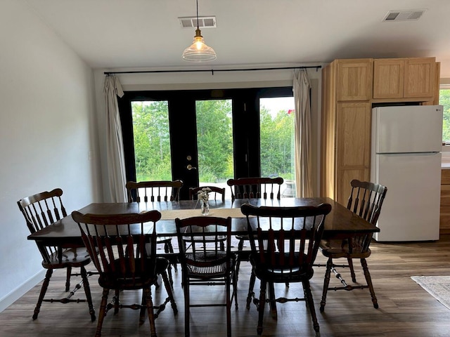 599 Mile Square Rd, Avon, ME 04966 - dining space with wood finished floors and french doors