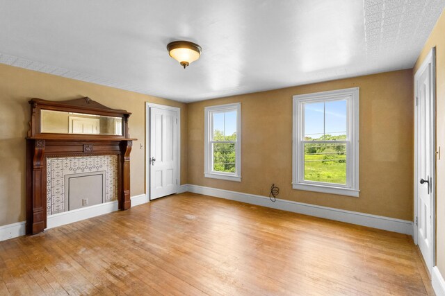 39 Elm St, South Thomaston, ME 04858 - unfurnished living room featuring wood finished floors and baseboards