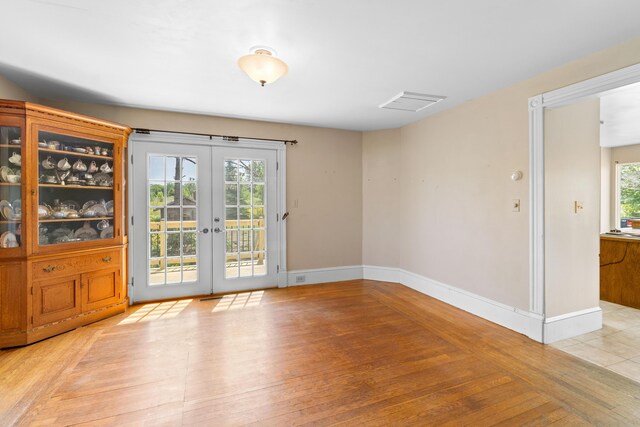 39 Elm St, South Thomaston, ME 04858 - unfurnished room featuring light wood-style floors and french doors