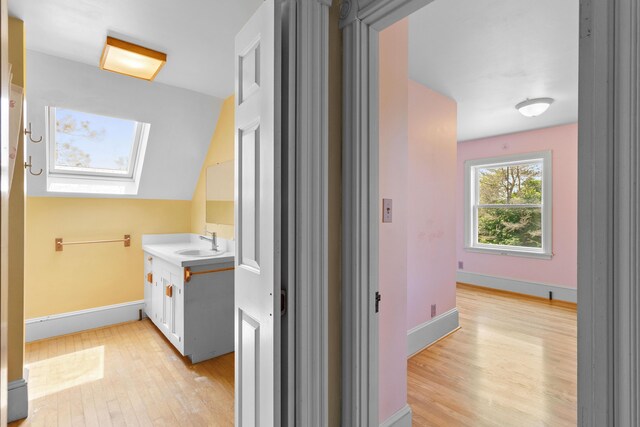 39 Elm St, South Thomaston, ME 04858 - bathroom with vanity, wood finished floors, and a skylight