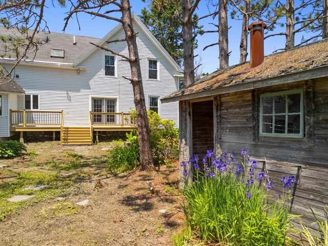 39 Elm St, South Thomaston, ME 04858 - rear view of property featuring a wooden deck and a chimney