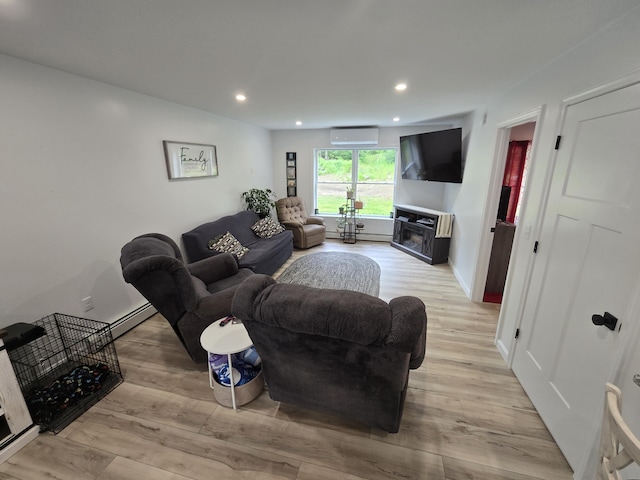 1083 N Rd, Newburgh, ME 04444 - living area featuring recessed lighting, light wood-style floors, a wall unit AC, and a fireplace