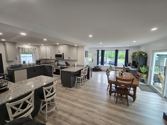1083 N Rd, Newburgh, ME 04444 - dining space featuring healthy amount of natural light, light wood-style flooring, and recessed lighting