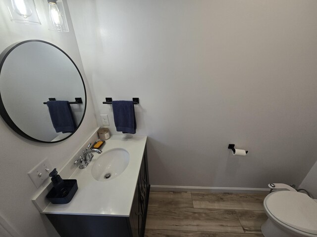 1083 N Rd, Newburgh, ME 04444 - half bath featuring wood finished floors and vanity
