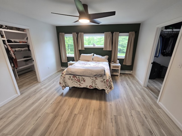 1083 N Rd, Newburgh, ME 04444 - bedroom with a spacious closet, a closet, and light wood-style flooring