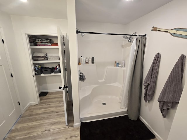 1083 N Rd, Newburgh, ME 04444 - bathroom with a stall shower and wood finished floors