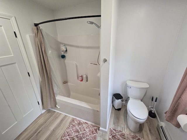 1083 N Rd, Newburgh, ME 04444 - bathroom with a baseboard radiator, wood finished floors, and shower / bath combo
