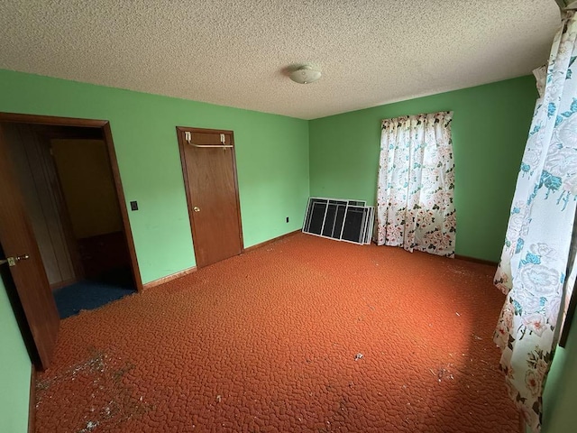 187 Richards Rd, Benton, ME 04901 - unfurnished bedroom with carpet, a textured ceiling, and a closet