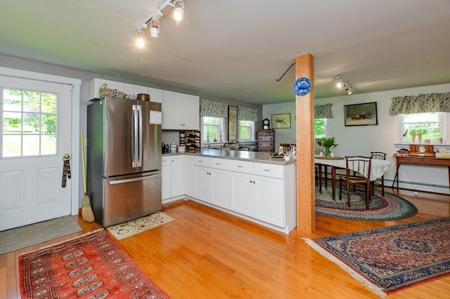 365 Waterville Rd, Skowhegan, ME 04976 - kitchen featuring freestanding refrigerator, rail lighting, and light wood-style floors