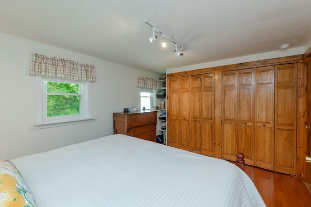 365 Waterville Rd, Skowhegan, ME 04976 - bedroom featuring track lighting, wood finished floors, and a closet