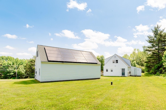 365 Waterville Rd, Skowhegan, ME 04976 - back of property with a lawn and roof mounted solar panels