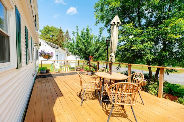 365 Waterville Rd, Skowhegan, ME 04976 - wooden terrace with outdoor dining area and view of scattered trees