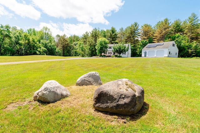 365 Waterville Rd, Skowhegan, ME 04976 - view of green lawn featuring an outbuilding and a garage