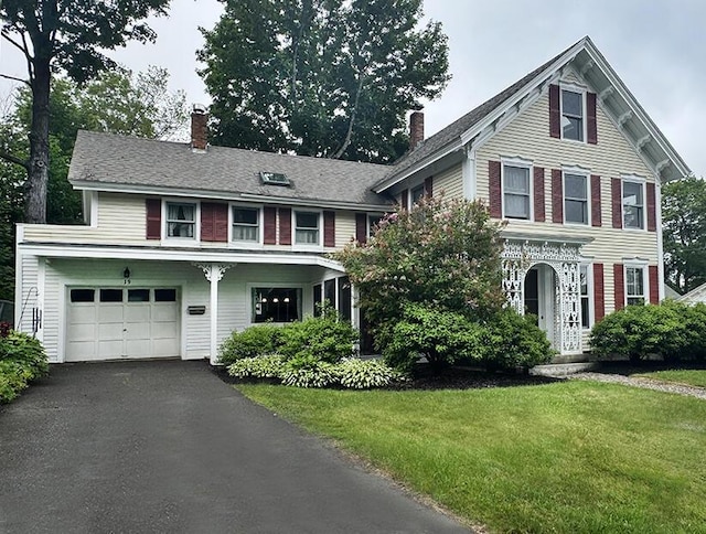 19 Union St, Hallowell, ME 04347 - view of front facade featuring a chimney, a garage, a front lawn, and asphalt driveway