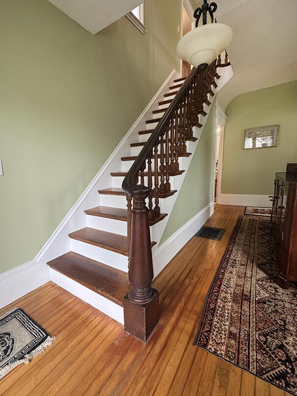 19 Union St, Hallowell, ME 04347 - stairs featuring hardwood / wood-style floors and baseboards