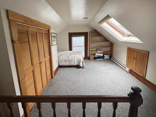 19 Union St, Hallowell, ME 04347 - bedroom with lofted ceiling, a baseboard heating unit, light colored carpet, a skylight, and a closet