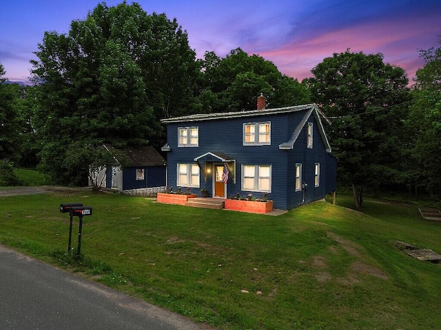 171 Bassett Rd, Winslow, ME 04901 - view of front of home featuring a yard and a chimney