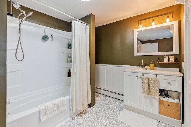 171 Bassett Rd, Winslow, ME 04901 - full bathroom with a baseboard radiator, shower / bathtub combination with curtain, a wainscoted wall, vanity, and tile patterned floors