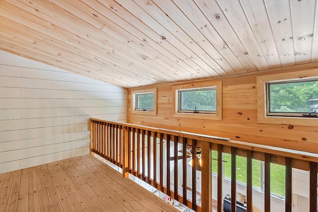 171 Bassett Rd, Winslow, ME 04901 - hallway with wooden ceiling, wooden walls, vaulted ceiling, and wood-type flooring
