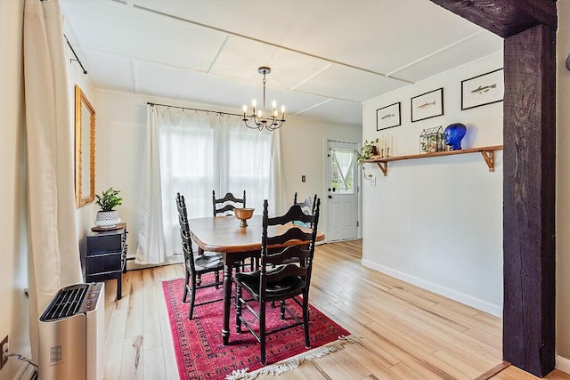 171 Bassett Rd, Winslow, ME 04901 - dining room with a chandelier and light wood-style flooring