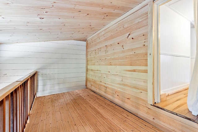171 Bassett Rd, Winslow, ME 04901 - bonus room featuring wooden walls, light wood-style floors, and wooden ceiling