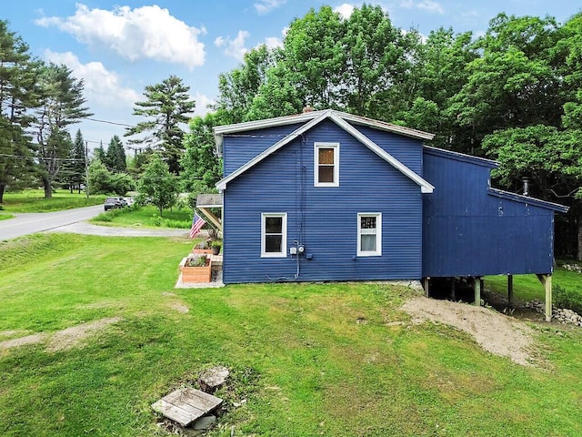 171 Bassett Rd, Winslow, ME 04901 - view of property exterior with a lawn
