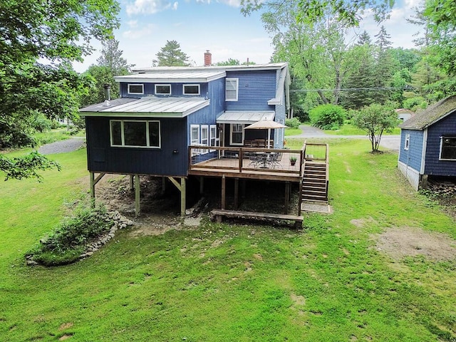 171 Bassett Rd, Winslow, ME 04901 - rear view of property featuring a wooden deck, a lawn, a metal roof, and stairs