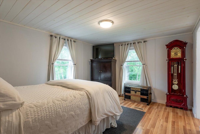 25 Pine View Ridge Rd, Boothbay, ME 04537 - bedroom with multiple windows, wood ceiling, light wood-style flooring, and crown molding