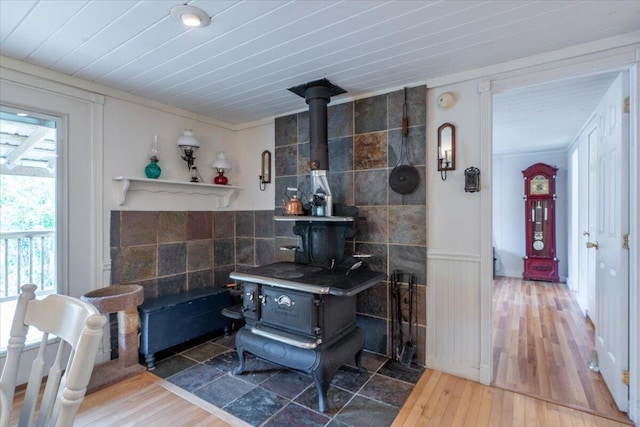 25 Pine View Ridge Rd, Boothbay, ME 04537 - kitchen featuring a wood stove and wood finished floors