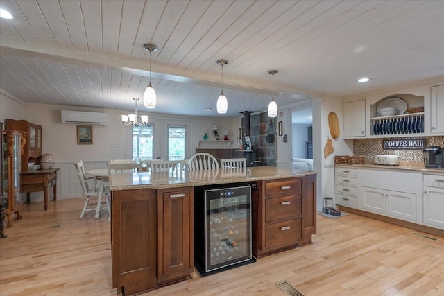 25 Pine View Ridge Rd, Boothbay, ME 04537 - kitchen with wine cooler, wooden ceiling, light wood-style floors, a wall unit AC, and white cabinets