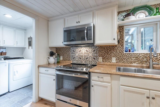 25 Pine View Ridge Rd, Boothbay, ME 04537 - kitchen with appliances with stainless steel finishes, independent washer and dryer, wooden ceiling, decorative backsplash, and white cabinetry