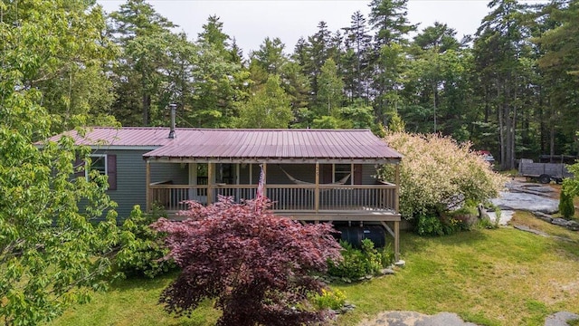 25 Pine View Ridge Rd, Boothbay, ME 04537 - rear view of house with a metal roof and a lawn