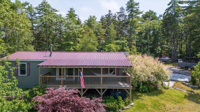 25 Pine View Ridge Rd, Boothbay, ME 04537 - rear view of house featuring a metal roof and a porch