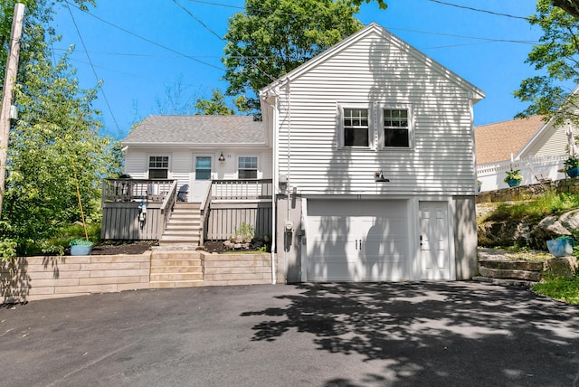 11 Farmhouse Way Unit 11, Ogunquit, ME 03907 - view of front of home with asphalt driveway, a garage, stairway, and a deck
