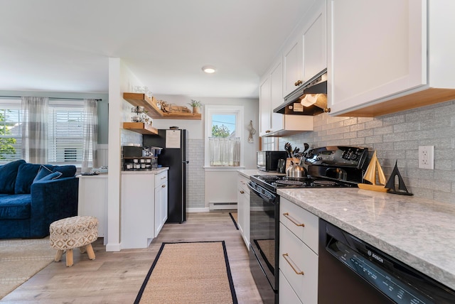 11 Farmhouse Way Unit 11, Ogunquit, ME 03907 - kitchen with black appliances, a baseboard radiator, plenty of natural light, and under cabinet range hood