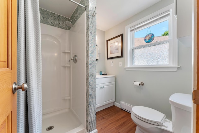11 Farmhouse Way Unit 11, Ogunquit, ME 03907 - bathroom with a shower stall, wood finished floors, a baseboard heating unit, and vanity
