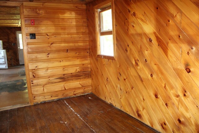 189 E Shore Rd, Benedicta Twp, ME 04733 - unfurnished room with a sauna, wood walls, and hardwood / wood-style flooring