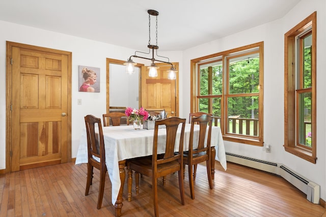 14 Moody Pond Rd, Windsor, ME 04363 - dining room featuring a baseboard heating unit and light wood finished floors