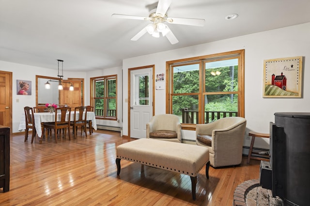 14 Moody Pond Rd, Windsor, ME 04363 - living area with plenty of natural light, light wood-style floors, a baseboard radiator, and ceiling fan