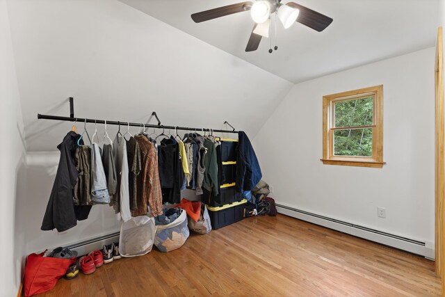 14 Moody Pond Rd, Windsor, ME 04363 - walk in closet with a baseboard heating unit, wood finished floors, lofted ceiling, and ceiling fan