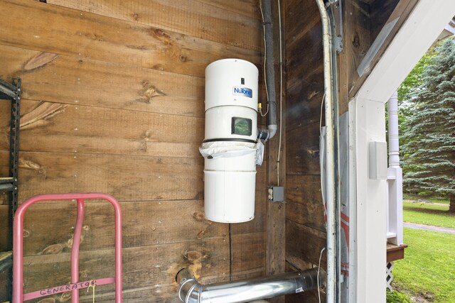 14 Moody Pond Rd, Windsor, ME 04363 - exterior view of wood walls and a central vacuum unit
