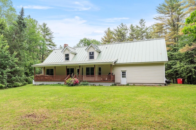 14 Moody Pond Rd, Windsor, ME 04363 - view of front of property featuring a chimney, a front yard, a porch, and a standing seam roof