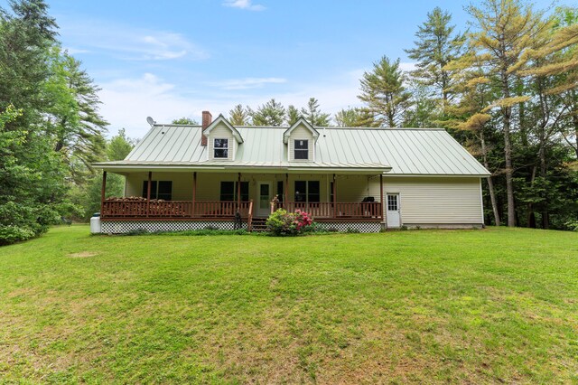 14 Moody Pond Rd, Windsor, ME 04363 - rear view of property with a chimney, a yard, a porch, and a metal roof