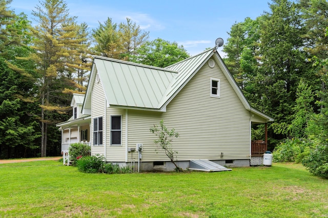 14 Moody Pond Rd, Windsor, ME 04363 - view of property exterior featuring a standing seam roof, a yard, and a metal roof