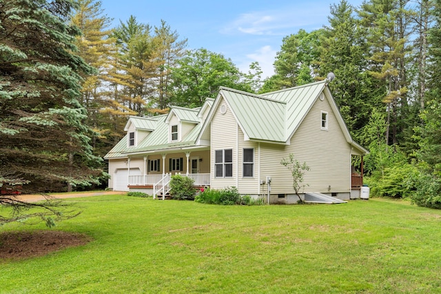 14 Moody Pond Rd, Windsor, ME 04363 - cape cod-style house with a porch, a front yard, a metal roof, and a standing seam roof